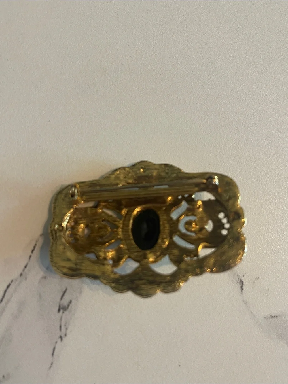 Gold Filigree Brooch with Black Cabochon